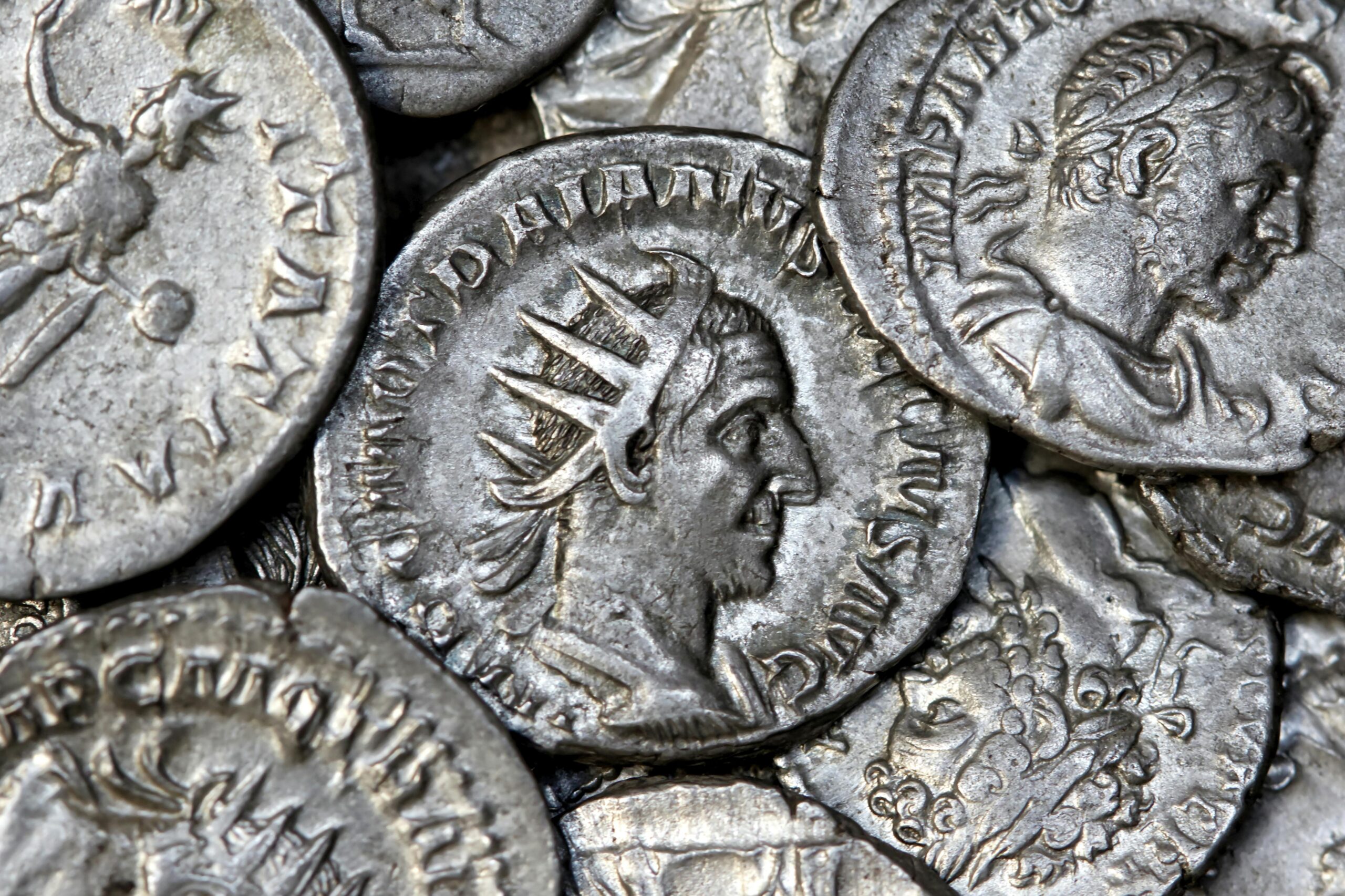 Close-up view of ancient Roman silver coins showcasing detailed engravings and historical significance.
